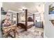 Spacious primary bedroom with decorative four poster bed and trey ceilings at 5005 Se 47Th Terrace Rd, Ocala, FL 34480