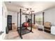 Bonus room with neutral carpet, fan, window, and work out equipment at 5005 Se 47Th Terrace Rd, Ocala, FL 34480