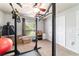 Bright exercise room with fitness rack, weights and workout equipment; ready for your fitness journey at 5005 Se 47Th Terrace Rd, Ocala, FL 34480