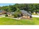 Beautiful single-story home with a mature palms and well-kept lawn at 5005 Se 47Th Terrace Rd, Ocala, FL 34480