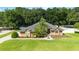 Charming single-story home with well-manicured landscaping and mature palms at 5005 Se 47Th Terrace Rd, Ocala, FL 34480