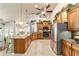 Gourmet kitchen with stainless appliances, granite counters, bar seating and an open layout at 5005 Se 47Th Terrace Rd, Ocala, FL 34480