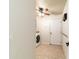 Neutral laundry room offering tiled floors, a ceiling fan, and a utility sink at 5005 Se 47Th Terrace Rd, Ocala, FL 34480