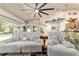 Bright living room with hardwood floors, an area rug, and plush seating, adjacent to the backyard pool at 5005 Se 47Th Terrace Rd, Ocala, FL 34480
