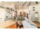 The living room showcases bar seating, hardwood floors, natural light, and views into other rooms at 5005 Se 47Th Terrace Rd, Ocala, FL 34480