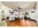 Bright living room showcasing hardwood floors, a ceiling fan, and an exercise machine at 5005 Se 47Th Terrace Rd, Ocala, FL 34480