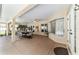 Inviting screened patio with ceiling fans and dining area, perfect for outdoor entertaining and relaxation at 5005 Se 47Th Terrace Rd, Ocala, FL 34480