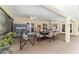 The covered patio offers views of backyard, ping pong, and dining area at 5005 Se 47Th Terrace Rd, Ocala, FL 34480