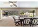 Great screened patio features views of pool, lush landscaping, and dining at 5005 Se 47Th Terrace Rd, Ocala, FL 34480