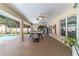 Enjoy the outdoors with this screened patio with pool views and ceiling fans at 5005 Se 47Th Terrace Rd, Ocala, FL 34480