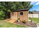 Backyard shed with a ramp and landscaping, offering practical outdoor storage at 5005 Se 47Th Terrace Rd, Ocala, FL 34480