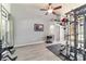 Bright workout room with gray walls, a ceiling fan, and exercise equipment creating the perfect fitness area at 5005 Se 47Th Terrace Rd, Ocala, FL 34480
