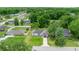 Aerial view of single-story home with expansive lawns and mature trees at 680 Nw 67Th Pl, Ocala, FL 34475