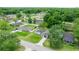 Neighborhood aerial view with mature trees, green lawns, and surrounding homes at 680 Nw 67Th Pl, Ocala, FL 34475