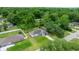 Beautiful aerial view of a neighborhood with many trees and large green lawns at 680 Nw 67Th Pl, Ocala, FL 34475