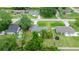 Aerial view of backyard with trampoline, fire pit and swimming pool at 680 Nw 67Th Pl, Ocala, FL 34475