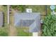 Aerial view of home's roof, yard, patio, and other outdoor ammenities at 680 Nw 67Th Pl, Ocala, FL 34475