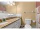 Bathroom with granite countertops, dual sinks, and a shower-tub combo at 680 Nw 67Th Pl, Ocala, FL 34475
