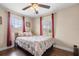 Well-lit bedroom with hardwood floors and a large window at 680 Nw 67Th Pl, Ocala, FL 34475