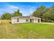 Charming single-story home with a well-manicured lawn and attached garage in a residential neighborhood at 680 Nw 67Th Pl, Ocala, FL 34475