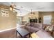 Spacious living room with vaulted ceilings that flows to the dining area and white kitchen at 680 Nw 67Th Pl, Ocala, FL 34475