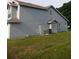This home has a generously sized backyard with a sliding glass door at 2233 Ardon Ave, Orlando, FL 32833