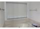 Bright bathroom featuring a soaking tub under a window providing a bright and relaxing retreat at 2233 Ardon Ave, Orlando, FL 32833