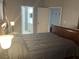 Bedroom featuring ensuite access to bathroom and closet offering added convenience and functionality at 2233 Ardon Ave, Orlando, FL 32833