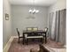 Dining room featuring a table with seating and a decorative chandelier at 2233 Ardon Ave, Orlando, FL 32833