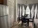 Eat-in kitchen features stainless steel appliances, tile flooring, and a bright sunny bay window at 2233 Ardon Ave, Orlando, FL 32833