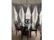 The eat-in kitchen boasts a glass top table and bay windows, perfect for enjoying meals at 2233 Ardon Ave, Orlando, FL 32833