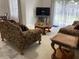 The cozy living room features comfortable seating and natural light at 2233 Ardon Ave, Orlando, FL 32833