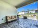 Charming back porch featuring cozy seating, fire pit, and pavers at 6612 Tempo Way, Groveland, FL 34736