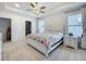 Bright main bedroom with a ceiling fan, walk in closet and lots of natural light at 6612 Tempo Way, Groveland, FL 34736