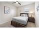 Cozy bedroom with neutral decor, carpet flooring, and a ceiling fan at 9478 Sw 52Nd Loop, Ocala, FL 34481
