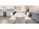 Dining room featuring modern white table, wood-look flooring, and ample natural light at 9478 Sw 52Nd Loop, Ocala, FL 34481