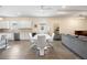 Bright and spacious dining area with contemporary table set and wood-look flooring at 9478 Sw 52Nd Loop, Ocala, FL 34481