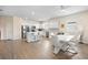 Open concept kitchen and dining area featuring stainless steel appliances and a center island at 9478 Sw 52Nd Loop, Ocala, FL 34481