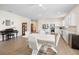 Open-concept kitchen, dining, and living area with modern furnishings and decor at 9478 Sw 52Nd Loop, Ocala, FL 34481