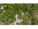Overhead aerial shot of a house nestled in a wooded area; driveway visible at 221 Se 167Th Ct, Silver Springs, FL 34488