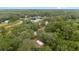 Aerial view of wooded property with house and pond; serene and private setting at 221 Se 167Th Ct, Silver Springs, FL 34488