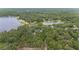 Aerial shot of a house in dense foliage near a lake at 221 Se 167Th Ct, Silver Springs, FL 34488