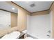 Bright bathroom featuring white tub, shower, toilet, vanity and mirror at 221 Se 167Th Ct, Silver Springs, FL 34488