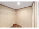 A simple closet offers ample storage space with a wire shelf and wood-look flooring at 221 Se 167Th Ct, Silver Springs, FL 34488