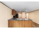 Open kitchen with black appliances and marble countertops, seamlessly connecting to the living area at 221 Se 167Th Ct, Silver Springs, FL 34488