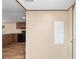 An open kitchen boasts wood cabinets, a black stove, and wood-look flooring at 221 Se 167Th Ct, Silver Springs, FL 34488