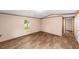 A light-filled living room features neutral walls and wood-look flooring at 221 Se 167Th Ct, Silver Springs, FL 34488