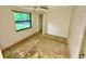 Bright bedroom with a view of a window and an open closet space at 3682 Jack Pine Ln, Ormond Beach, FL 32174
