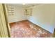 Bedroom with built-in shelving and a window at 3682 Jack Pine Ln, Ormond Beach, FL 32174