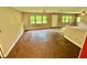 Large living room featuring multiple windows and hardwood floors at 3682 Jack Pine Ln, Ormond Beach, FL 32174